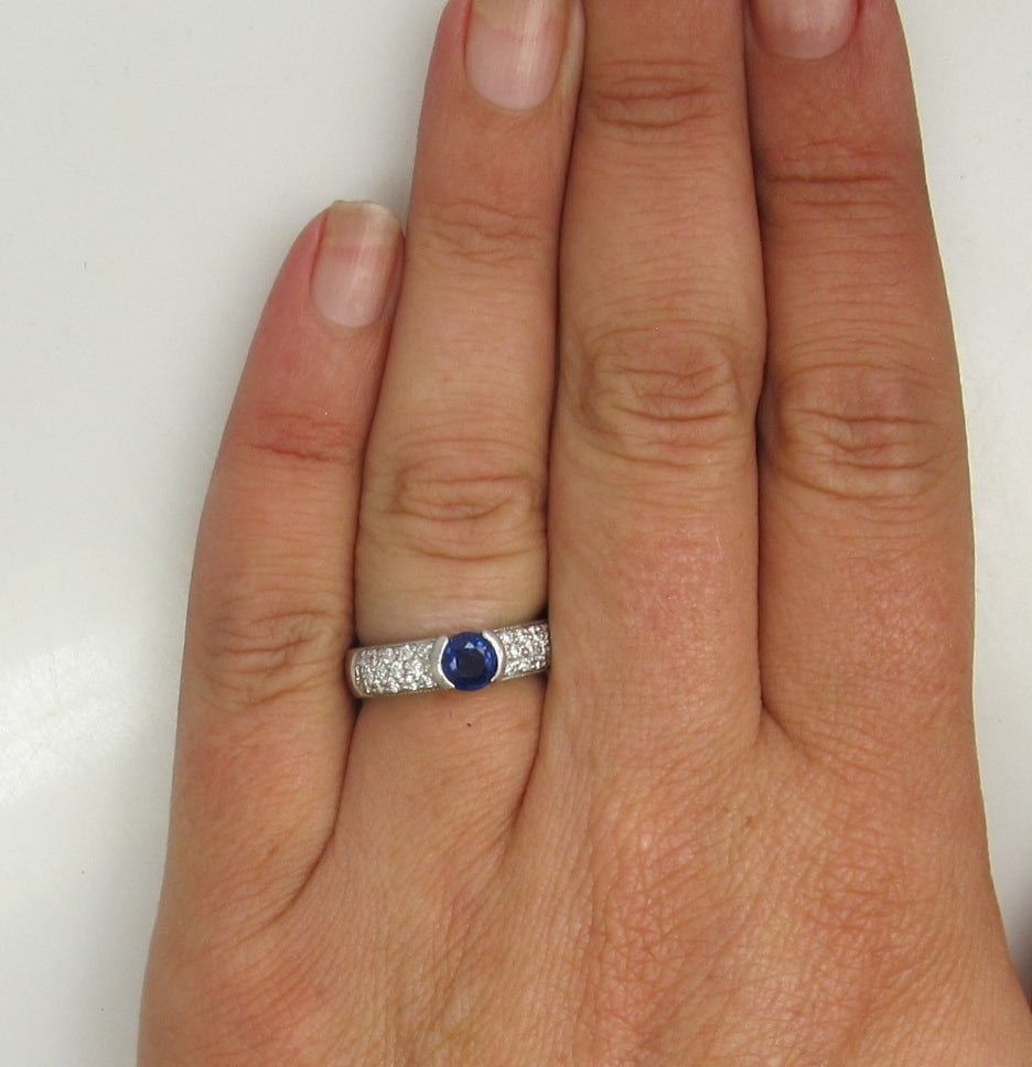 Platinum Ring With A .50ct Sapphire And .50cts Tw In Diamonds.