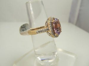 14k rose gold ring with amethyst and .50cts in diamonds