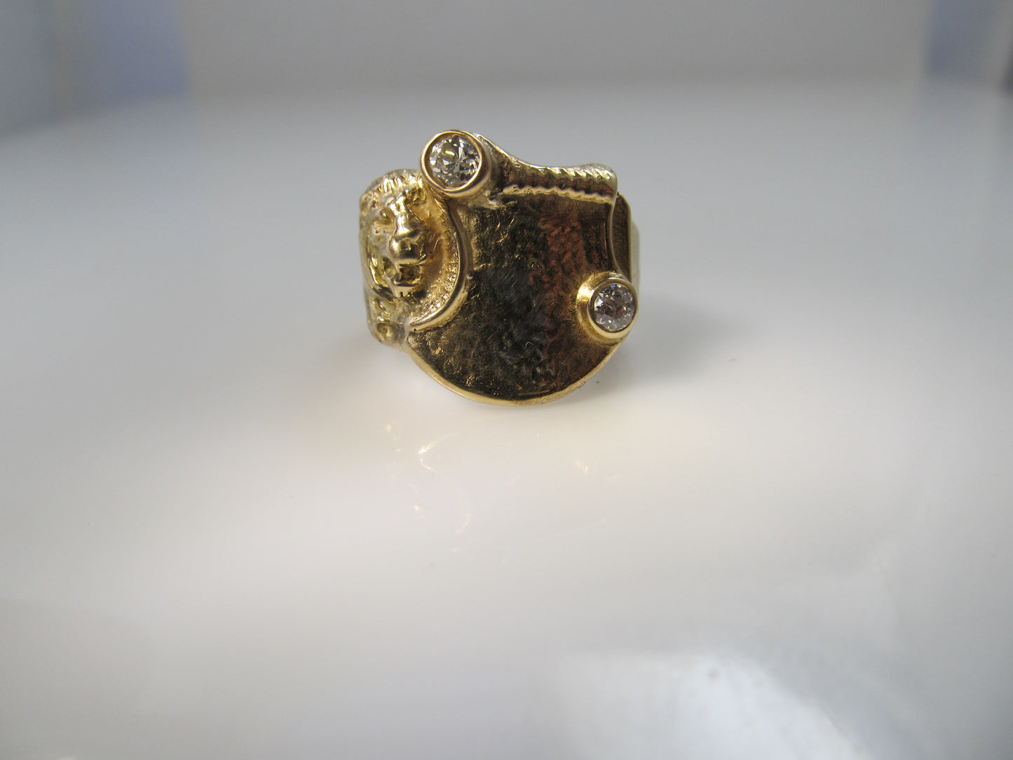Art Nouveau lion signet ring with diamonds