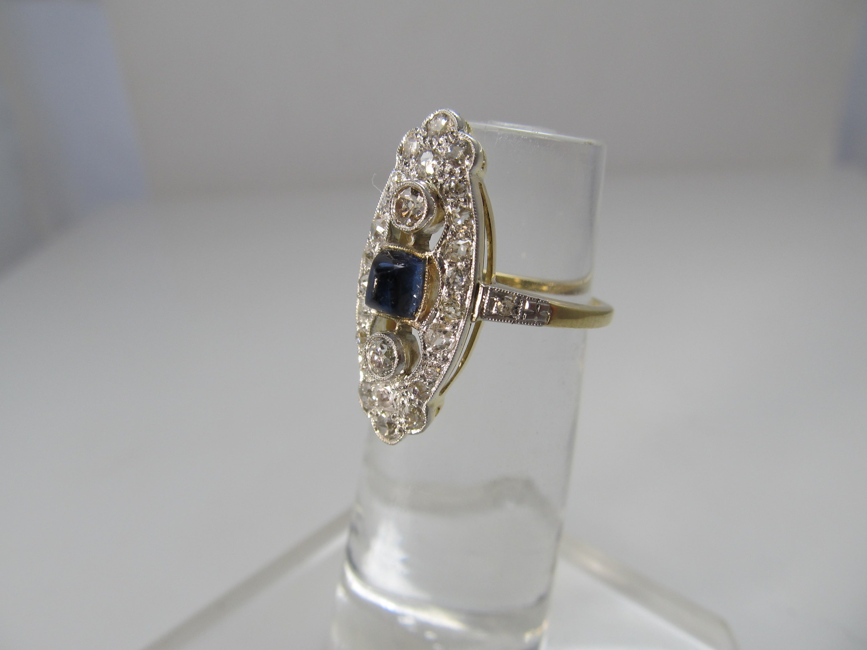 Navette shaped sapphire and diamond ring, 14k and platinum