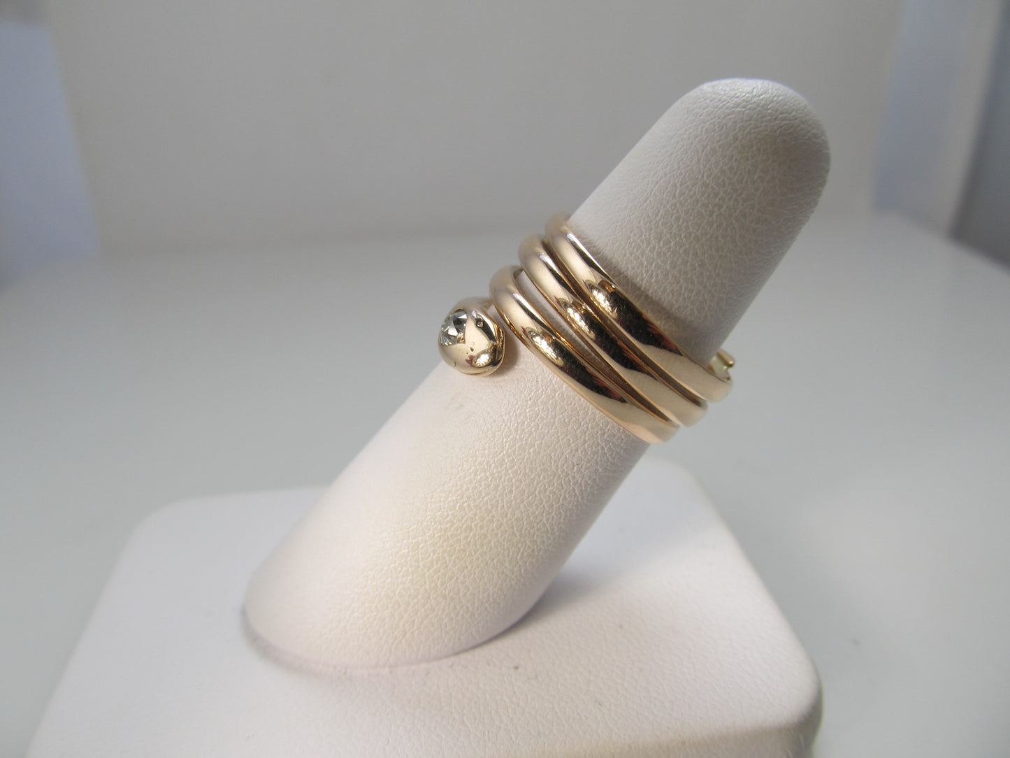 Antique coiled rose gold snake ring with a diamond