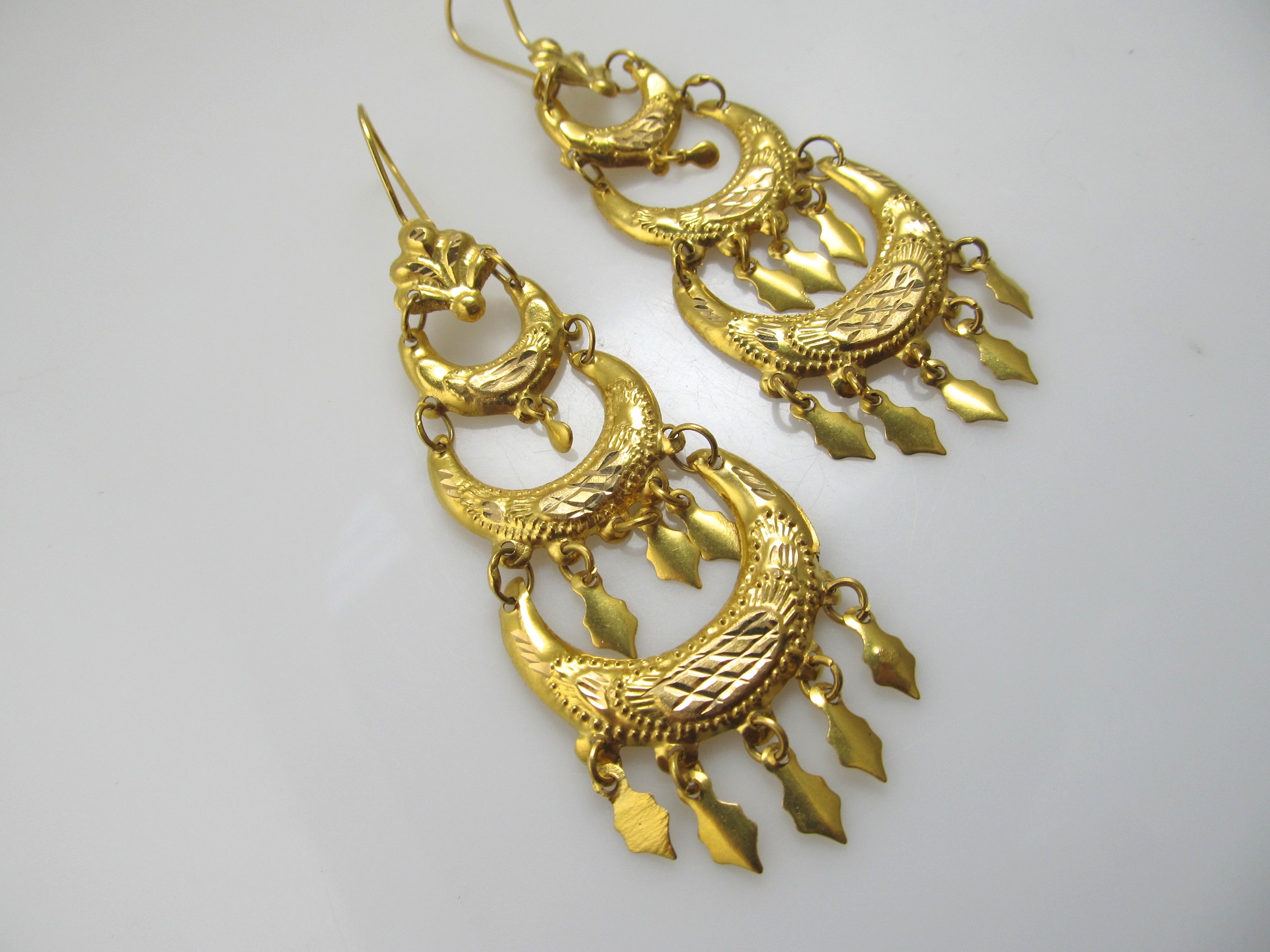 Long bright 18k yellow gold dangle earrings