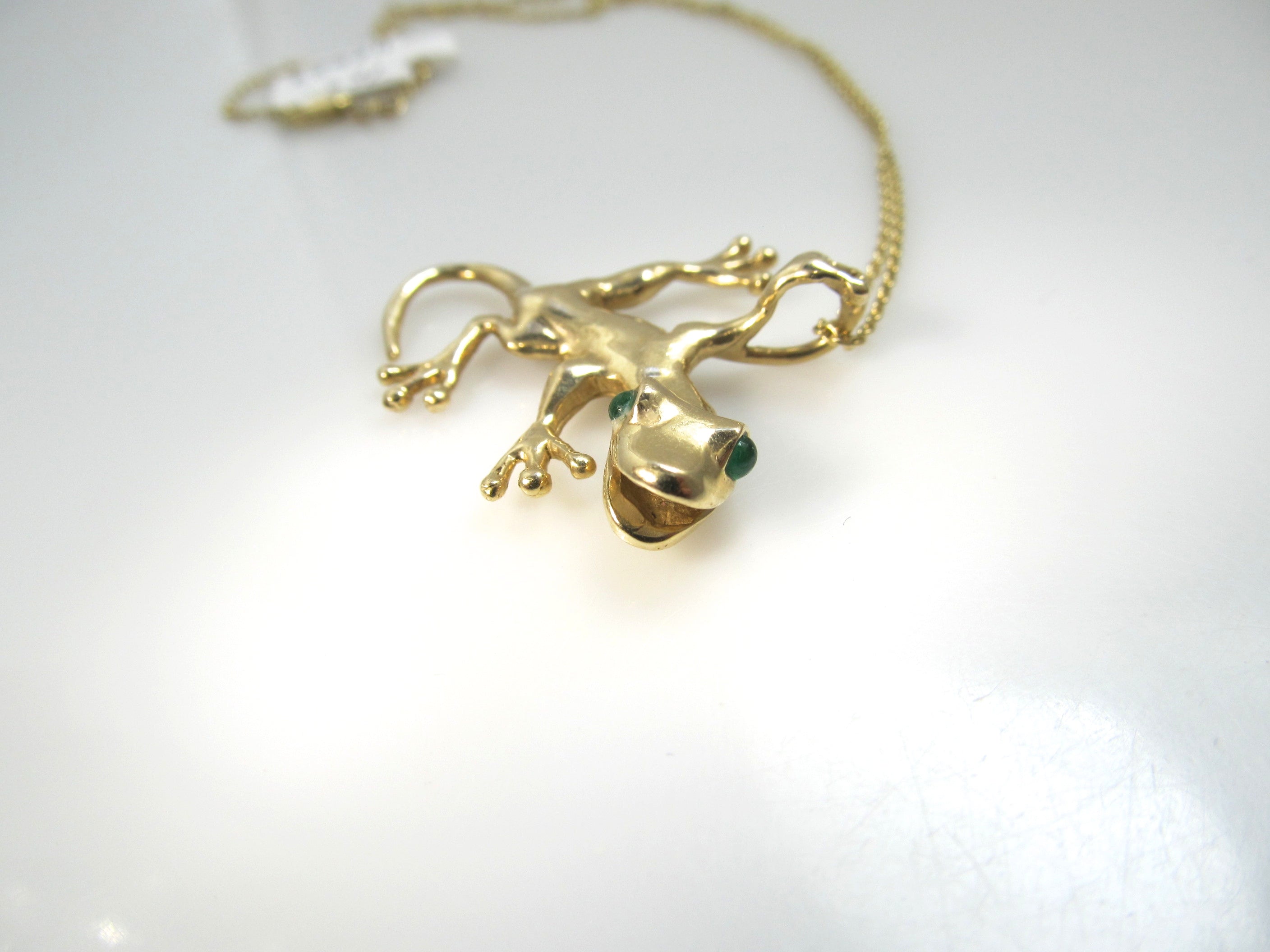 Super cute 14k gold gecko necklace with emerald eyes