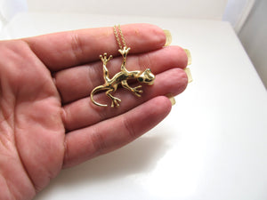 Super cute 14k gold gecko necklace with emerald eyes