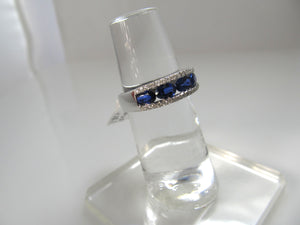 Bright blue sapphire diamond band, 18k white gold