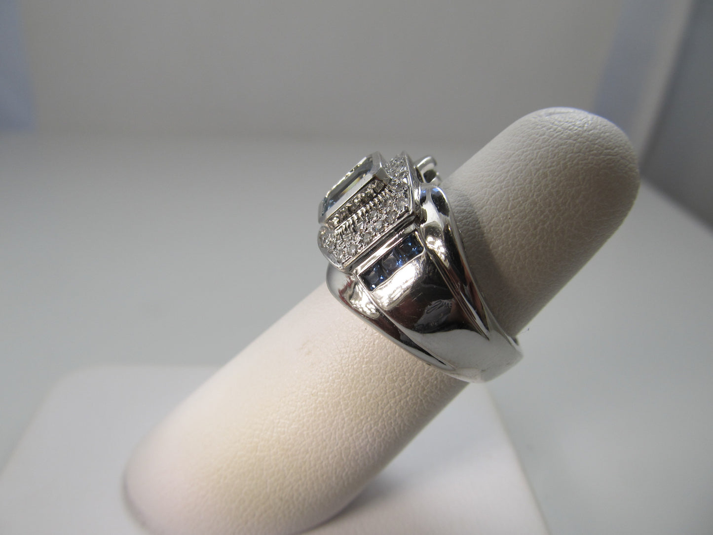 Modern aquamarine, sapphire and diamond ring