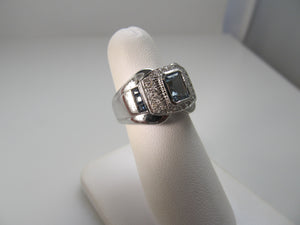 Modern aquamarine, sapphire and diamond ring