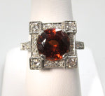 Huge antique platinum ring with a garnet and diamonds
