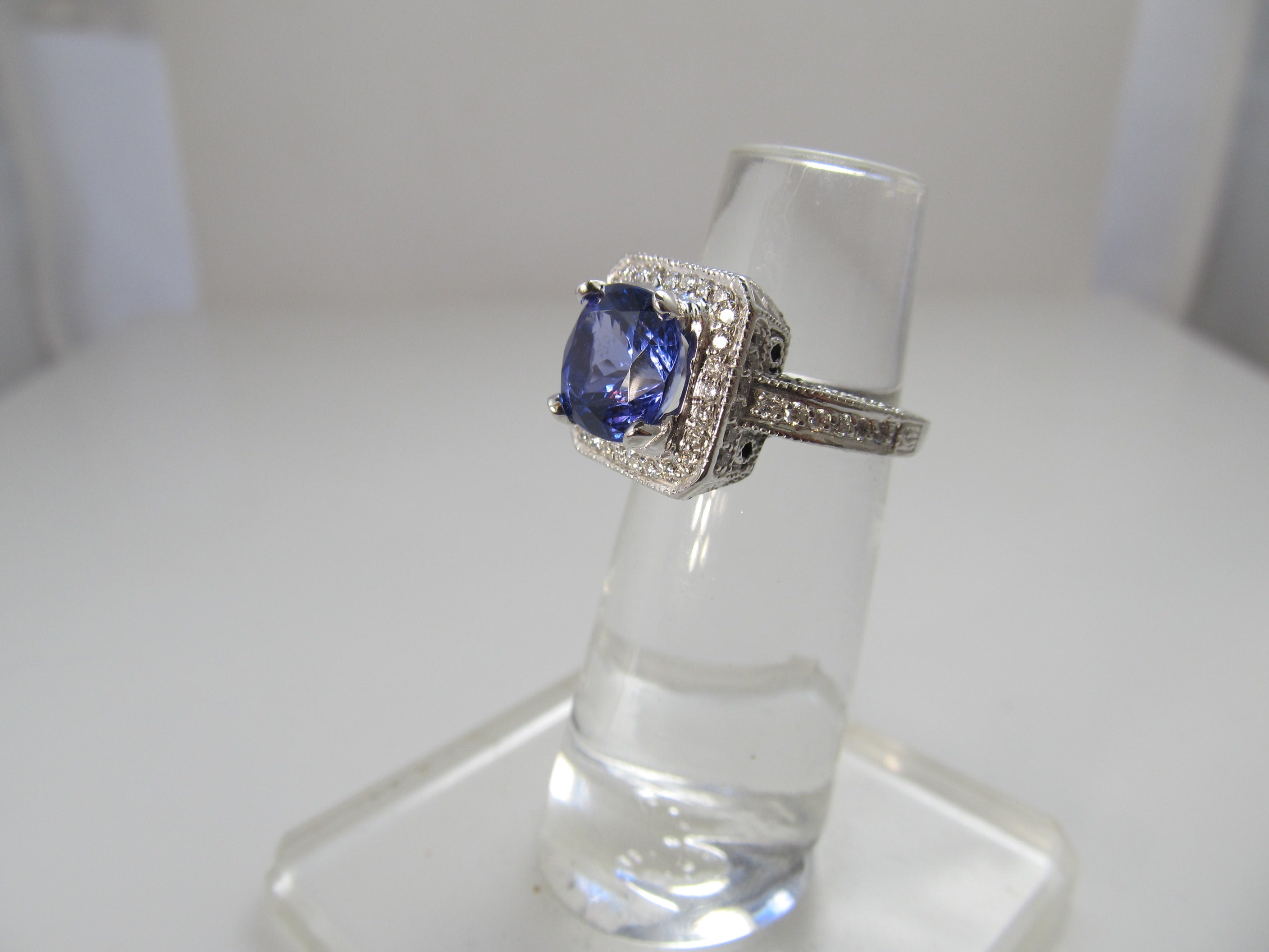 2.75ct tanzanite and diamond halo ring