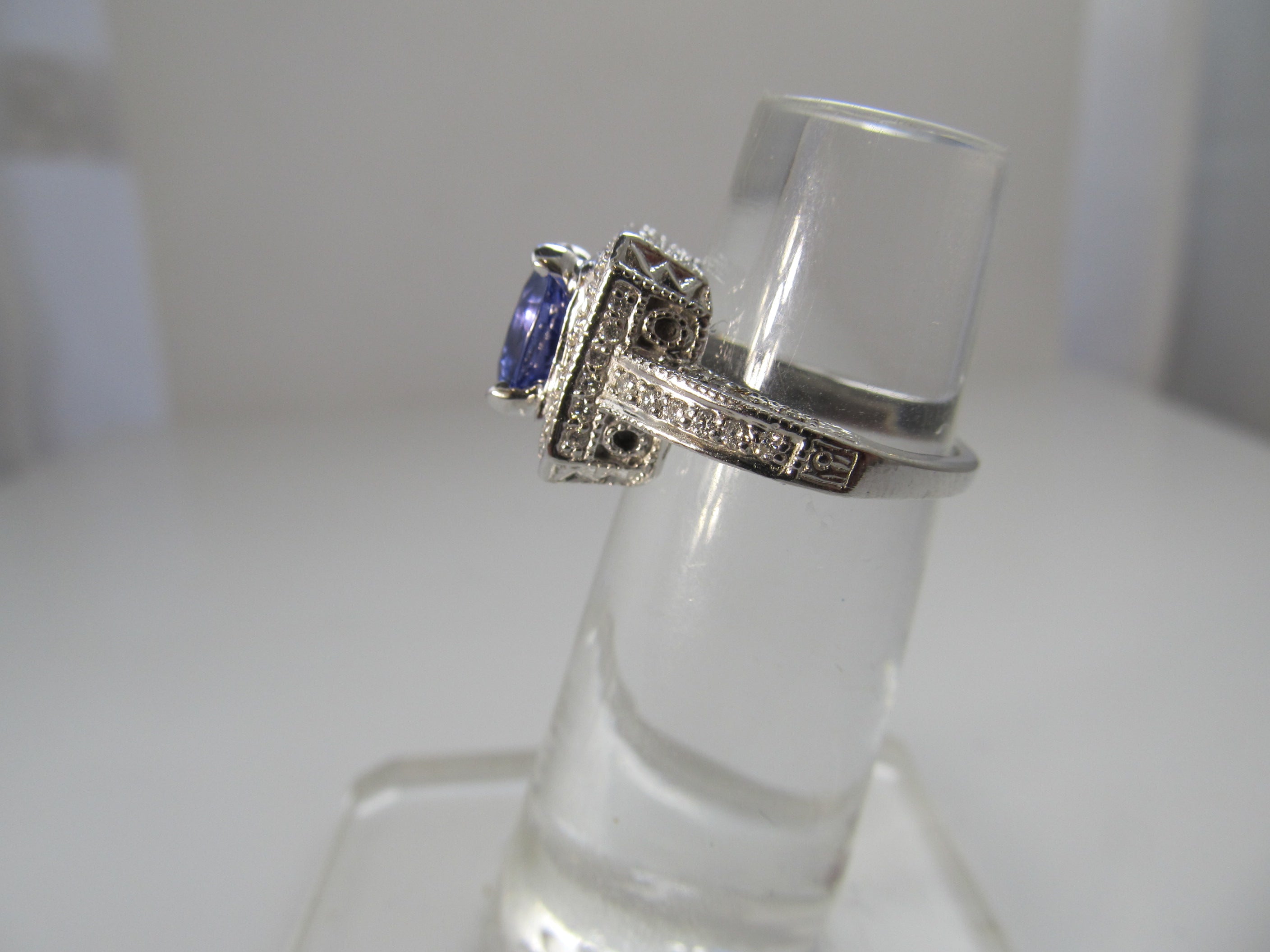 2.75ct tanzanite and diamond halo ring