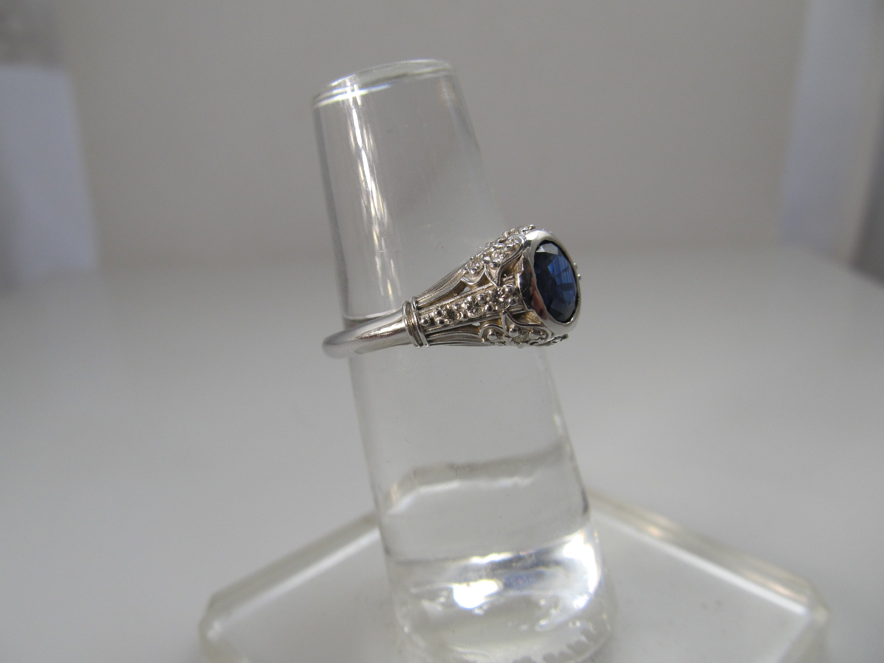 Filigree ring with a sapphire and diamonds