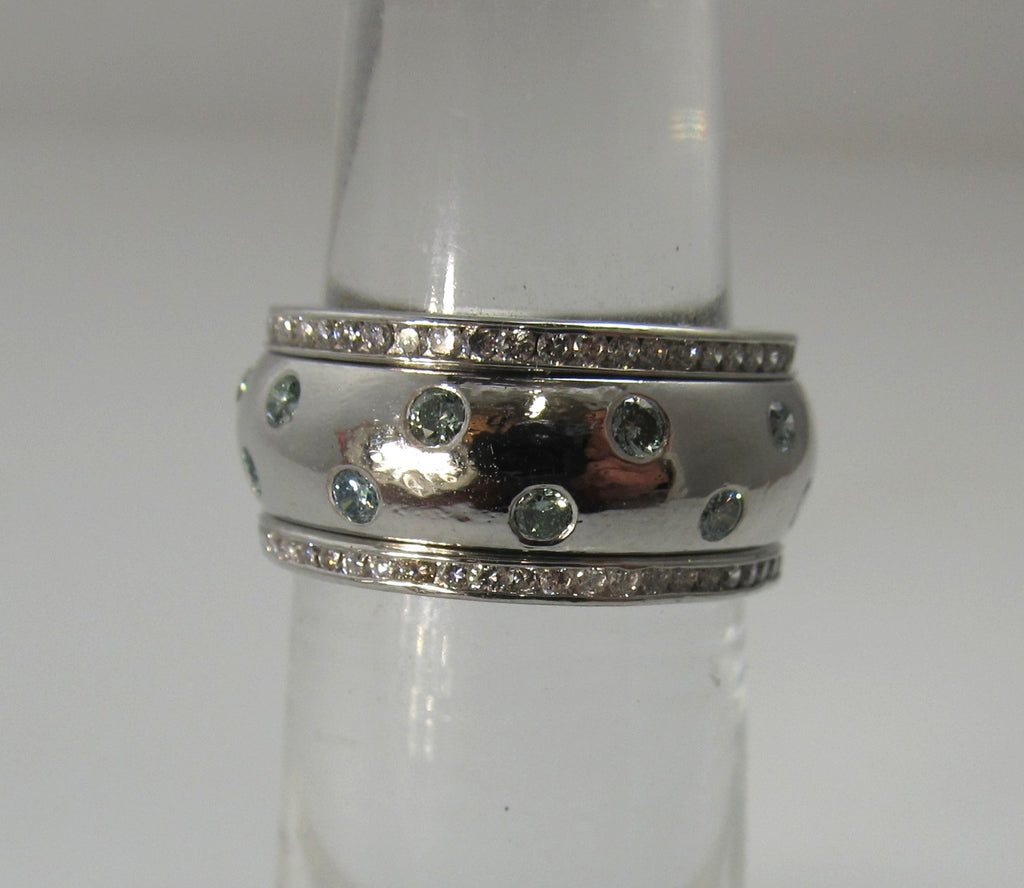 Platinum eternity band with light blue and white diamonds
