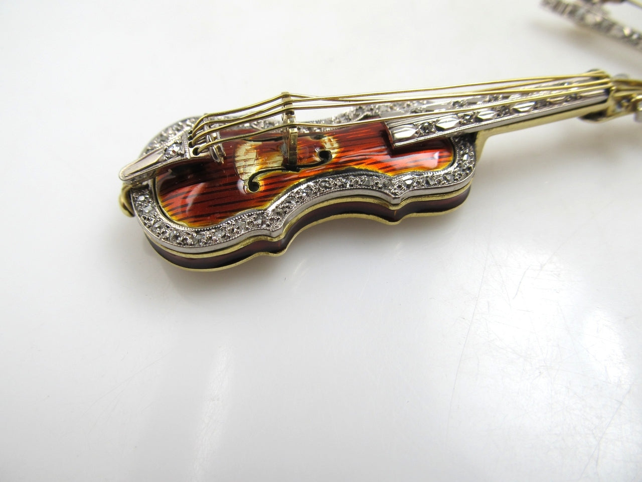18k yellow gold enamel stylized violin brooch with diamonds