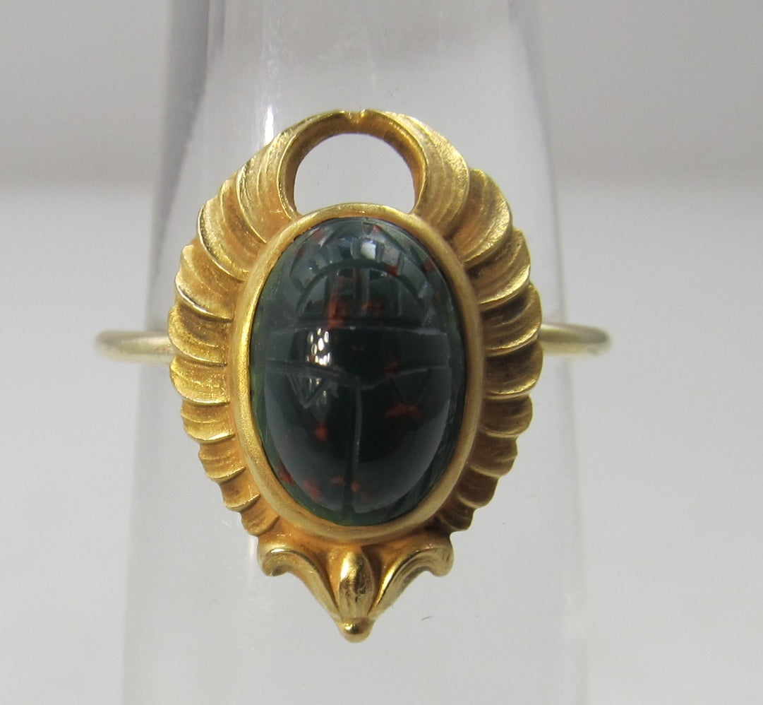 Egyptian revival conversion ring with a bloodstone scarab, circa 1920.