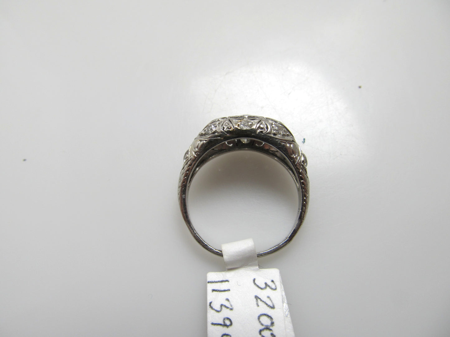Antique platinum filigree diamond dome ring