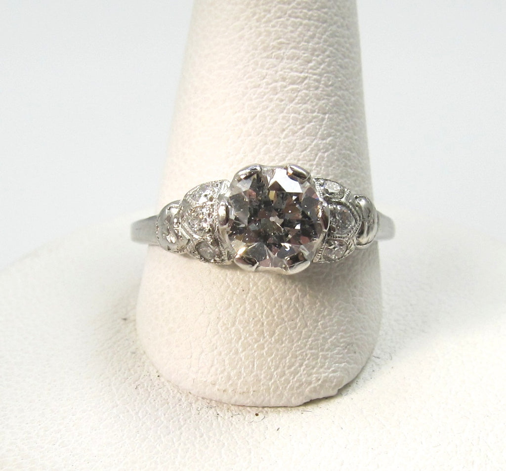 Antique platinum filigree ring with a .88ct diamond