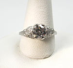 Antique platinum filigree ring with a .88ct diamond