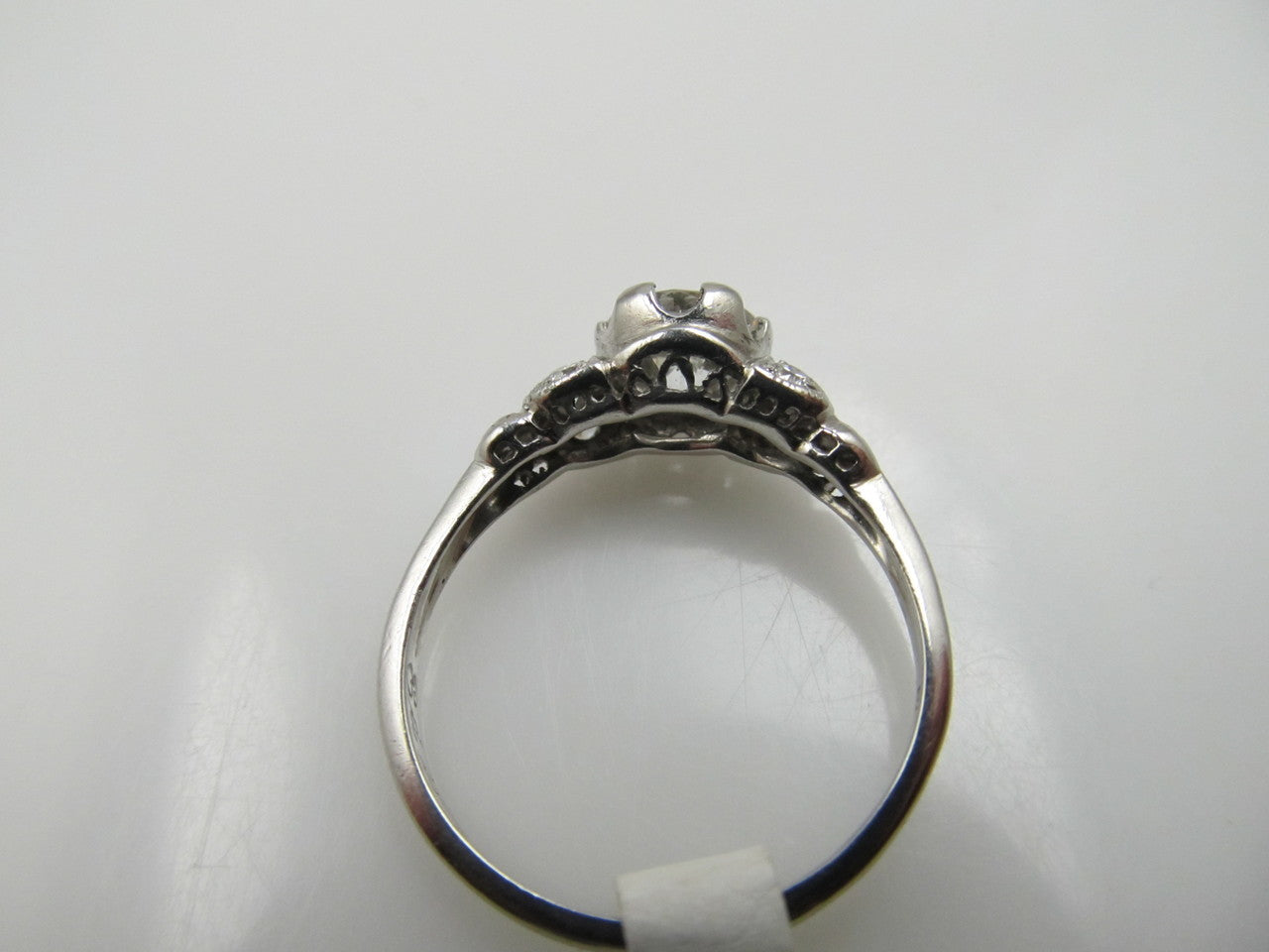 Antique platinum filigree ring with a .88ct diamond