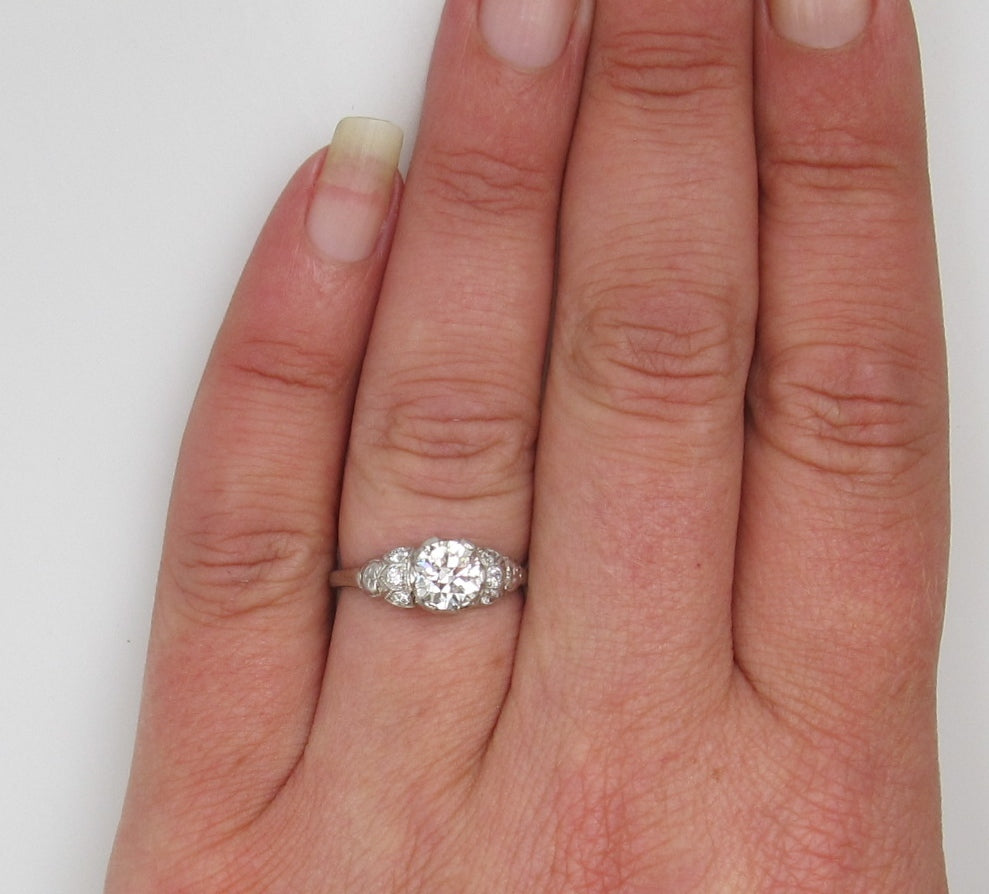Antique platinum filigree ring with a .88ct diamond