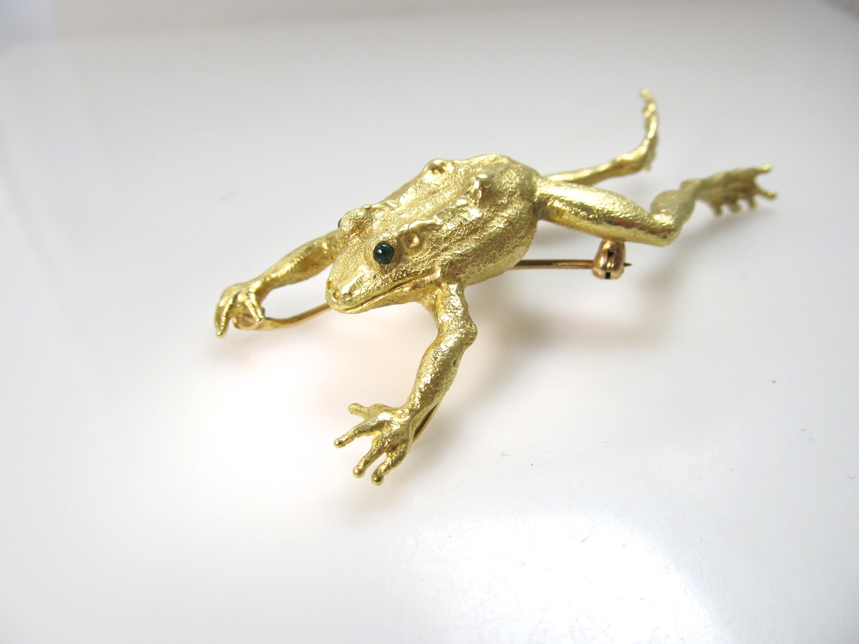 Signed AH 18k yellow gold leaping frog pendant, emerald eyes