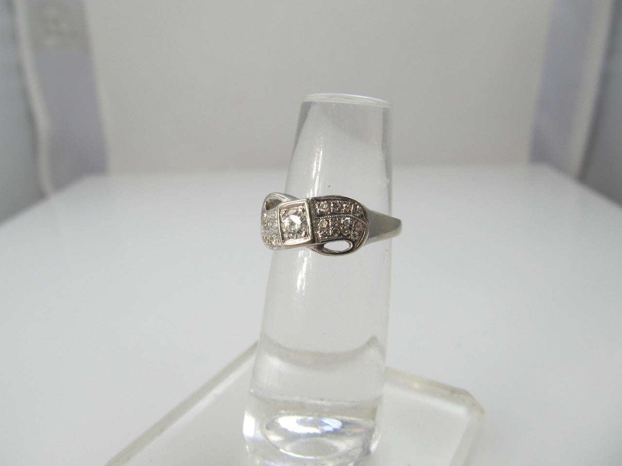 14k white gold ring with a .35ct center diamond, dated 1966
