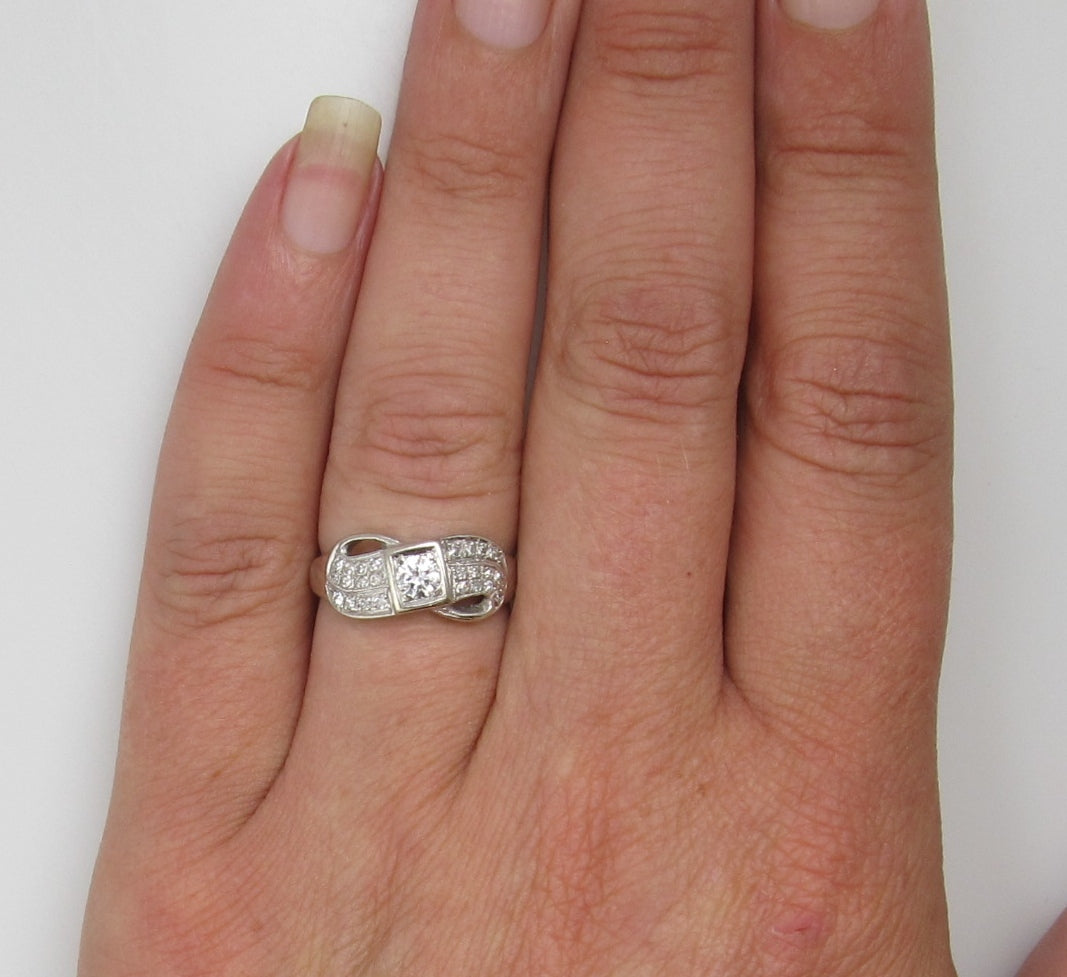 14k white gold ring with a .35ct center diamond, dated 1966