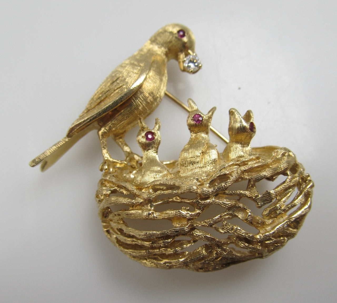 14k yellow gold bird and nest pin with rubies and a diamond, circa 1960