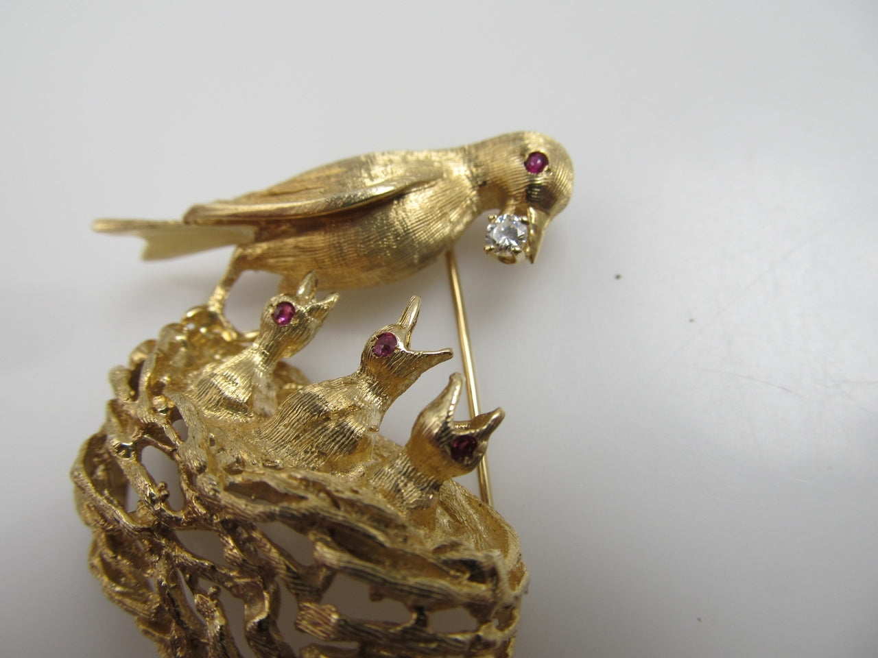 14k yellow gold bird and nest pin with rubies and a diamond, circa 1960