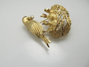 14k yellow gold bird and nest pin with rubies and a diamond, circa 1960