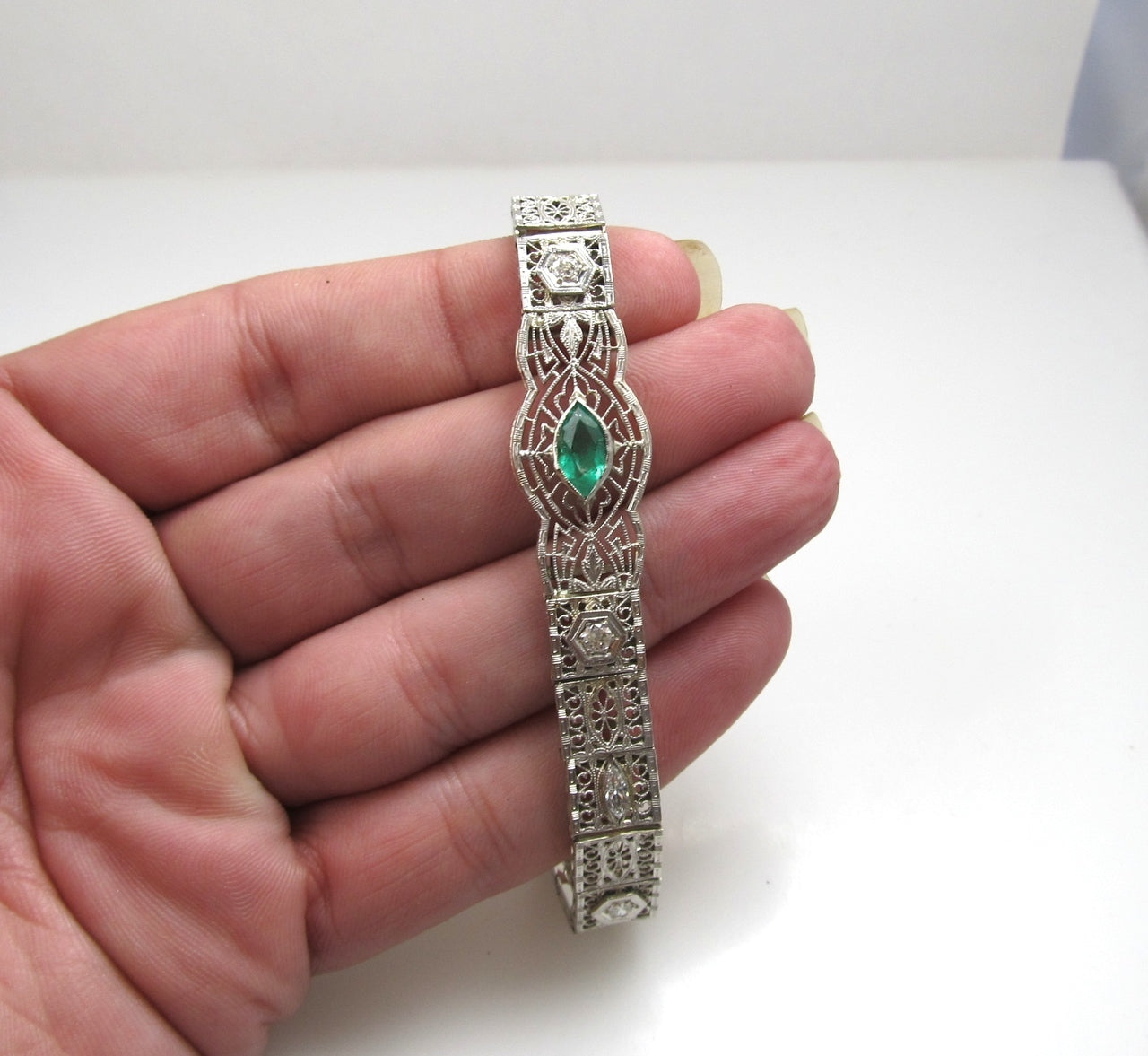 Platinum And 14k Filigree Bracelet With A .80ct Emerald And .70cts In Diamonds, Circa 1920