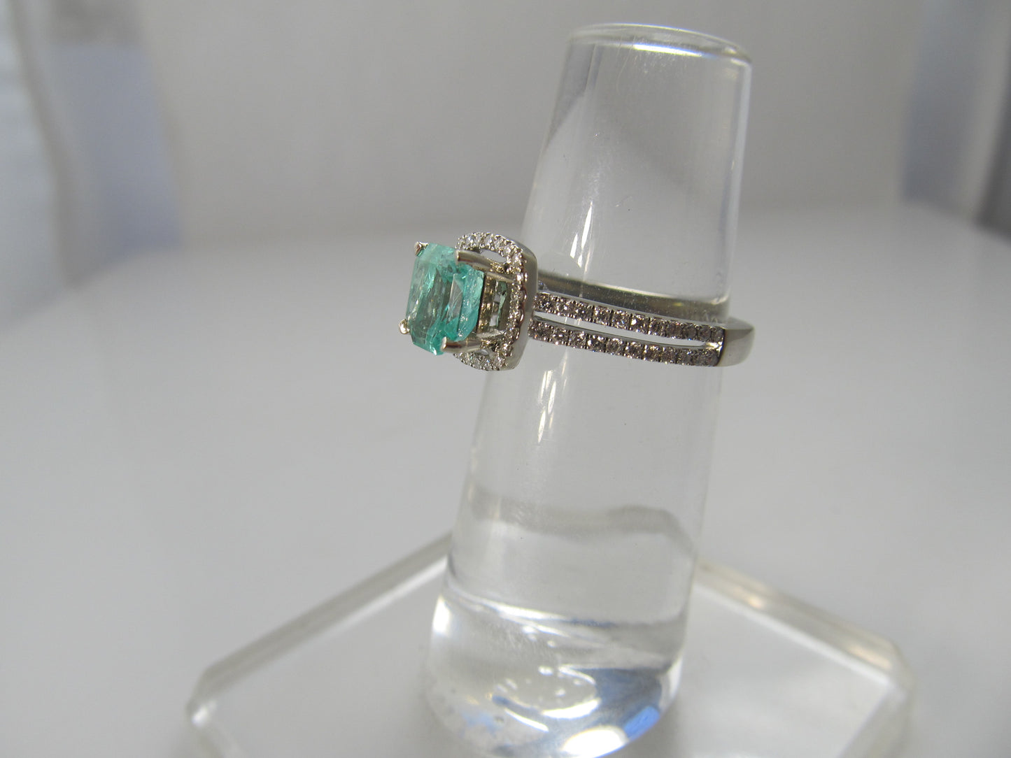 Modern 1.10ct emerald and diamond ring