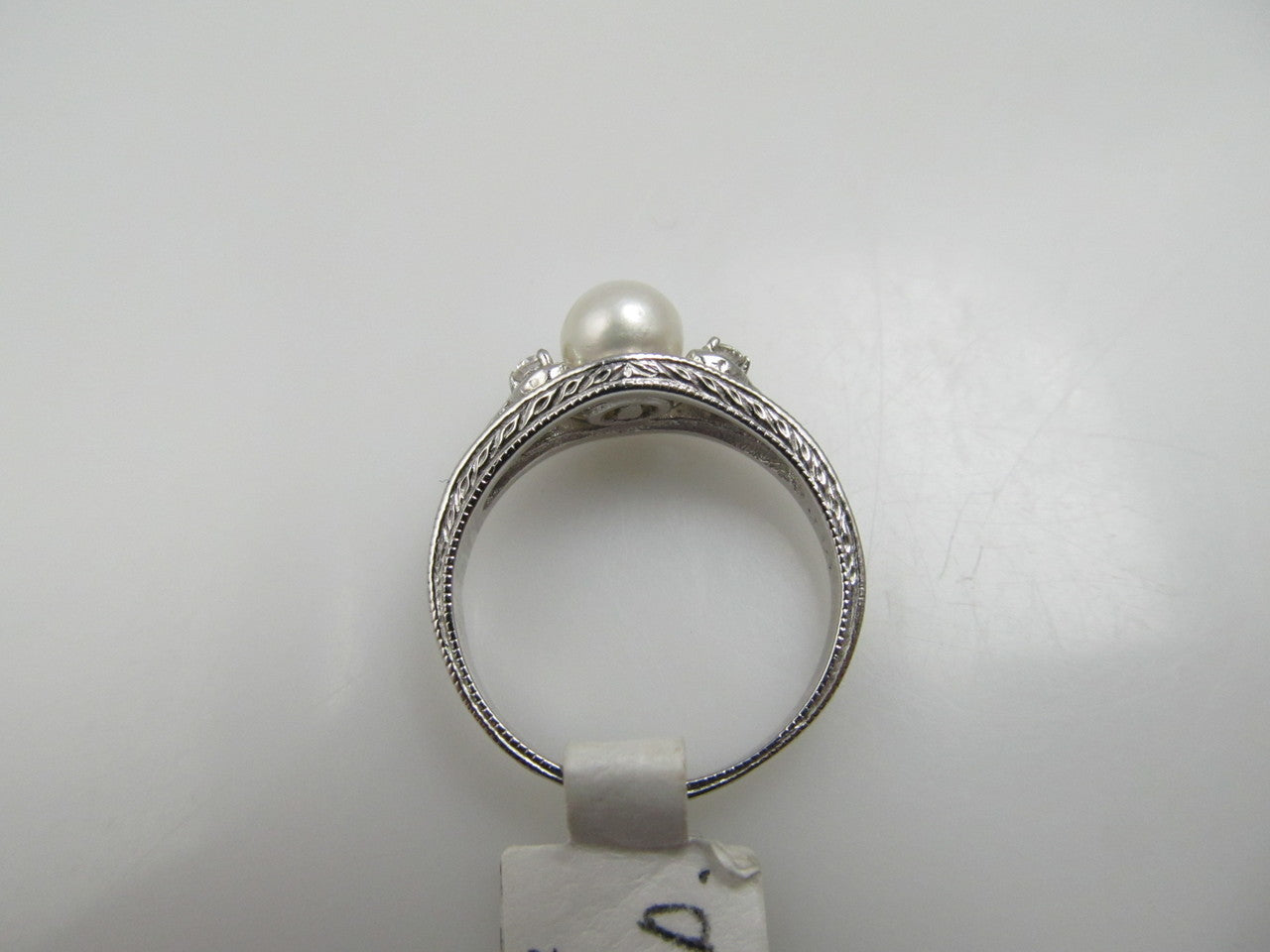 14k white gold ring with diamonds and a pearl
