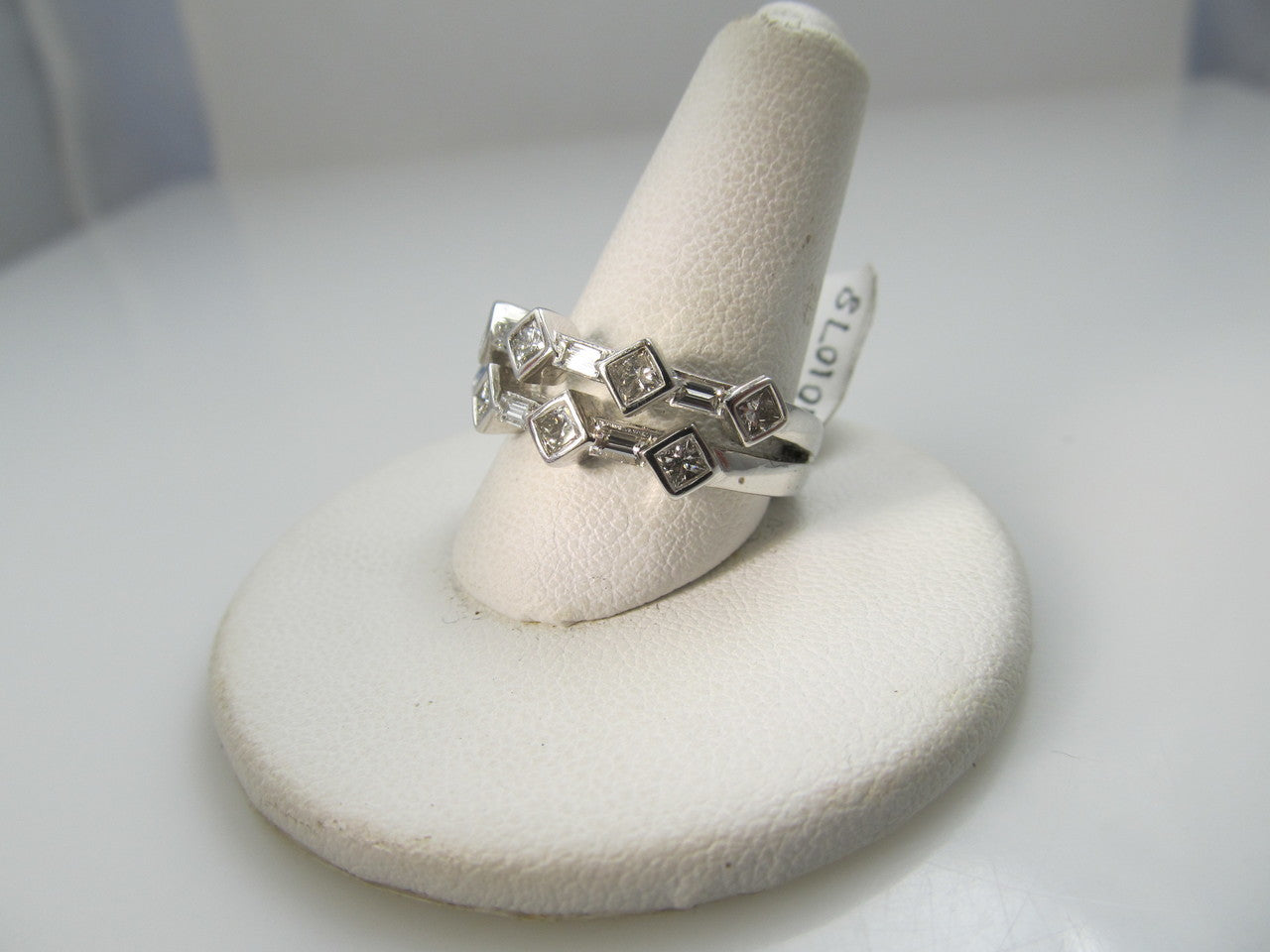 14k White Gold Ring With .85cts In Princess And Baguette Cut Diamonds.