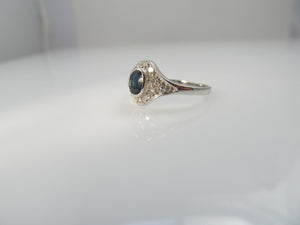 14k white gold ring with a .25ct sapphire and diamonds