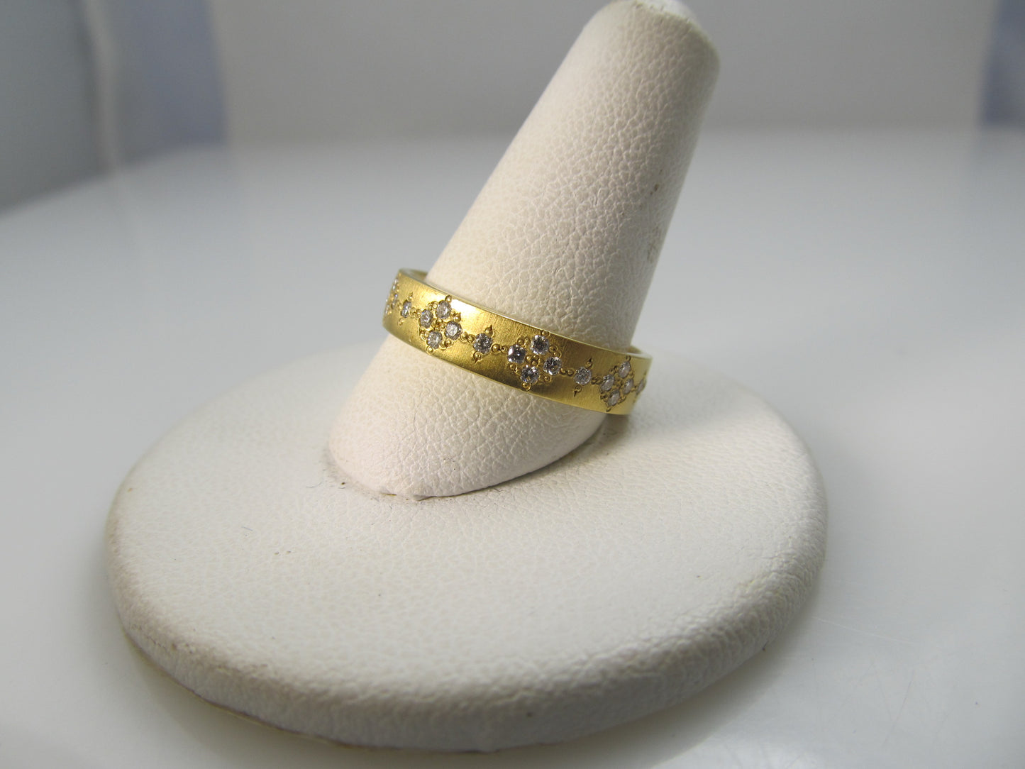 18k gold band with .50cts in diamonds by Adel Chefridi.  Retail $3,900
