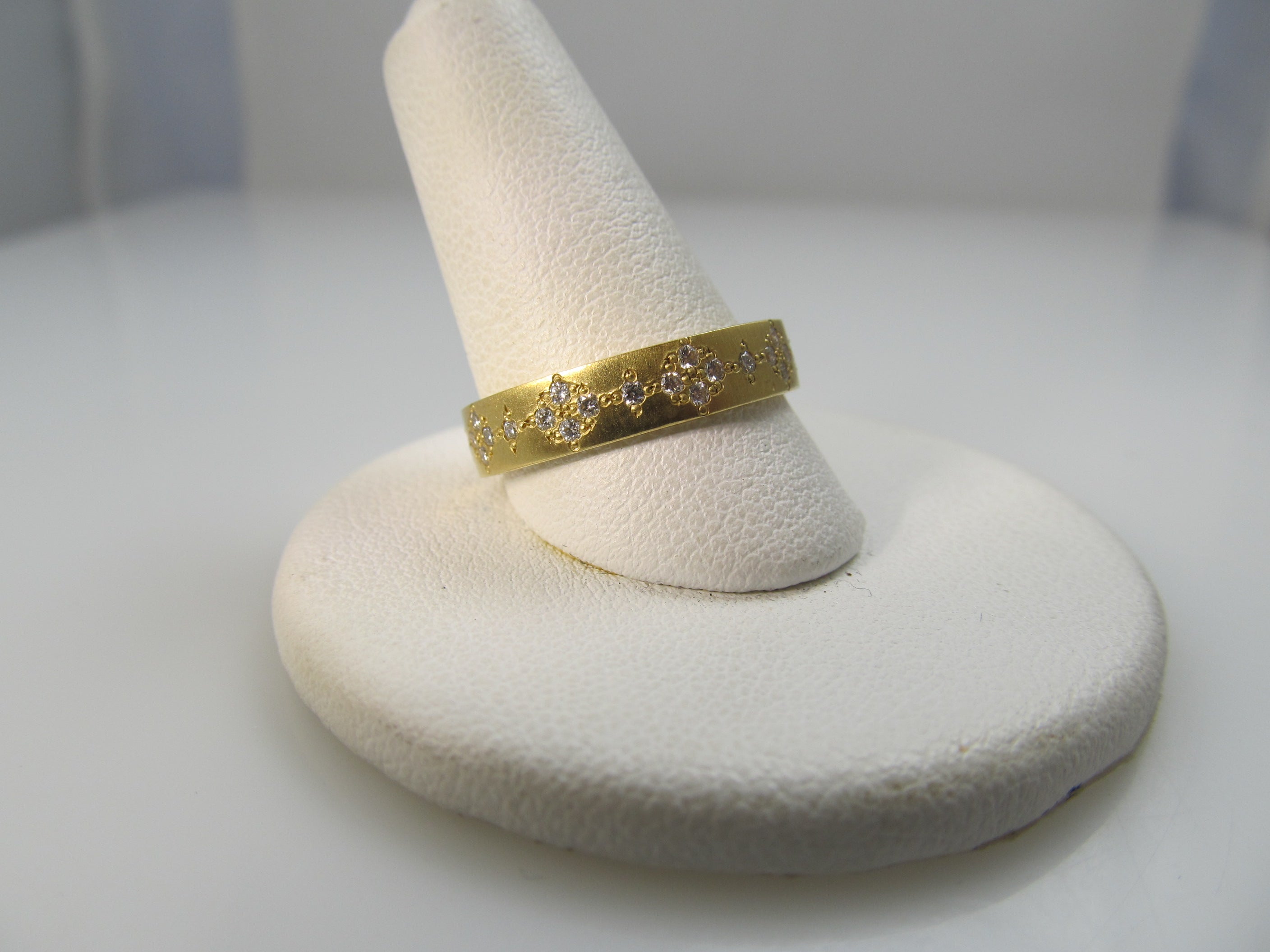 18k gold band with .50cts in diamonds by Adel Chefridi.  Retail $3,900