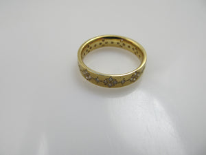 18k gold band with .50cts in diamonds by Adel Chefridi.  Retail $3,900