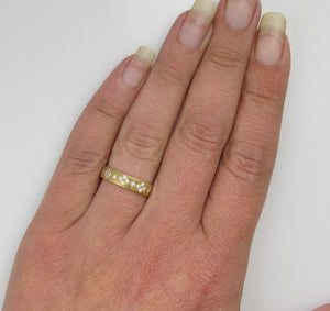 18k gold band with .50cts in diamonds by Adel Chefridi.  Retail $3,900