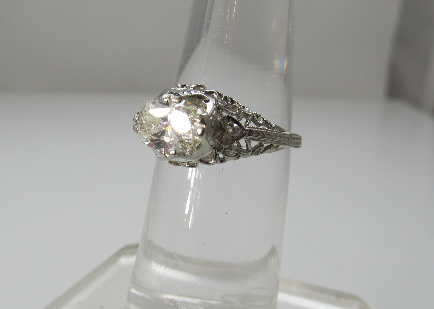 18k White Gold Filigree Ring With A 1.21ct Oval Cut Diamond, Circa 1920