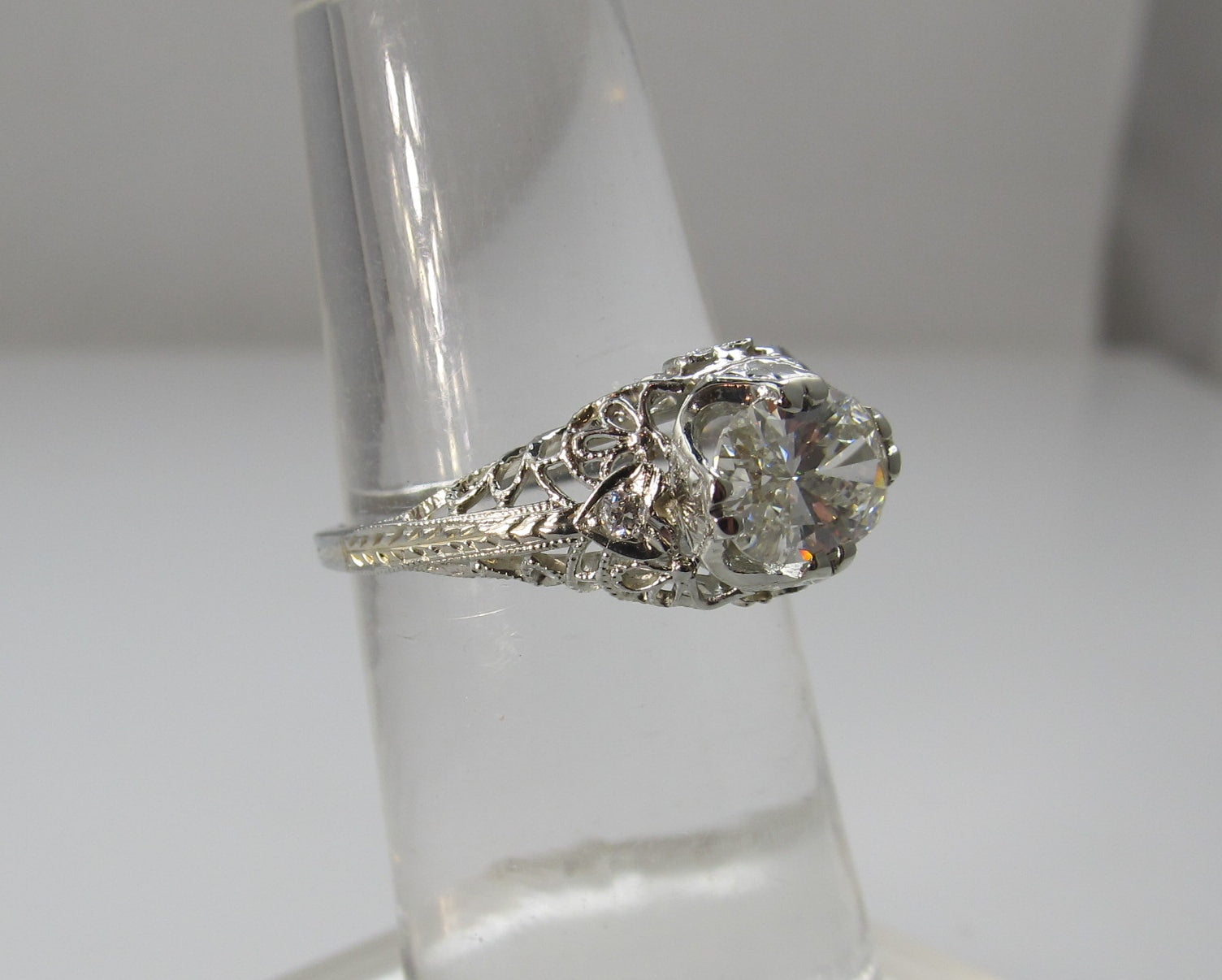 18k White Gold Filigree Ring With A 1.21ct Oval Cut Diamond, Circa 1920