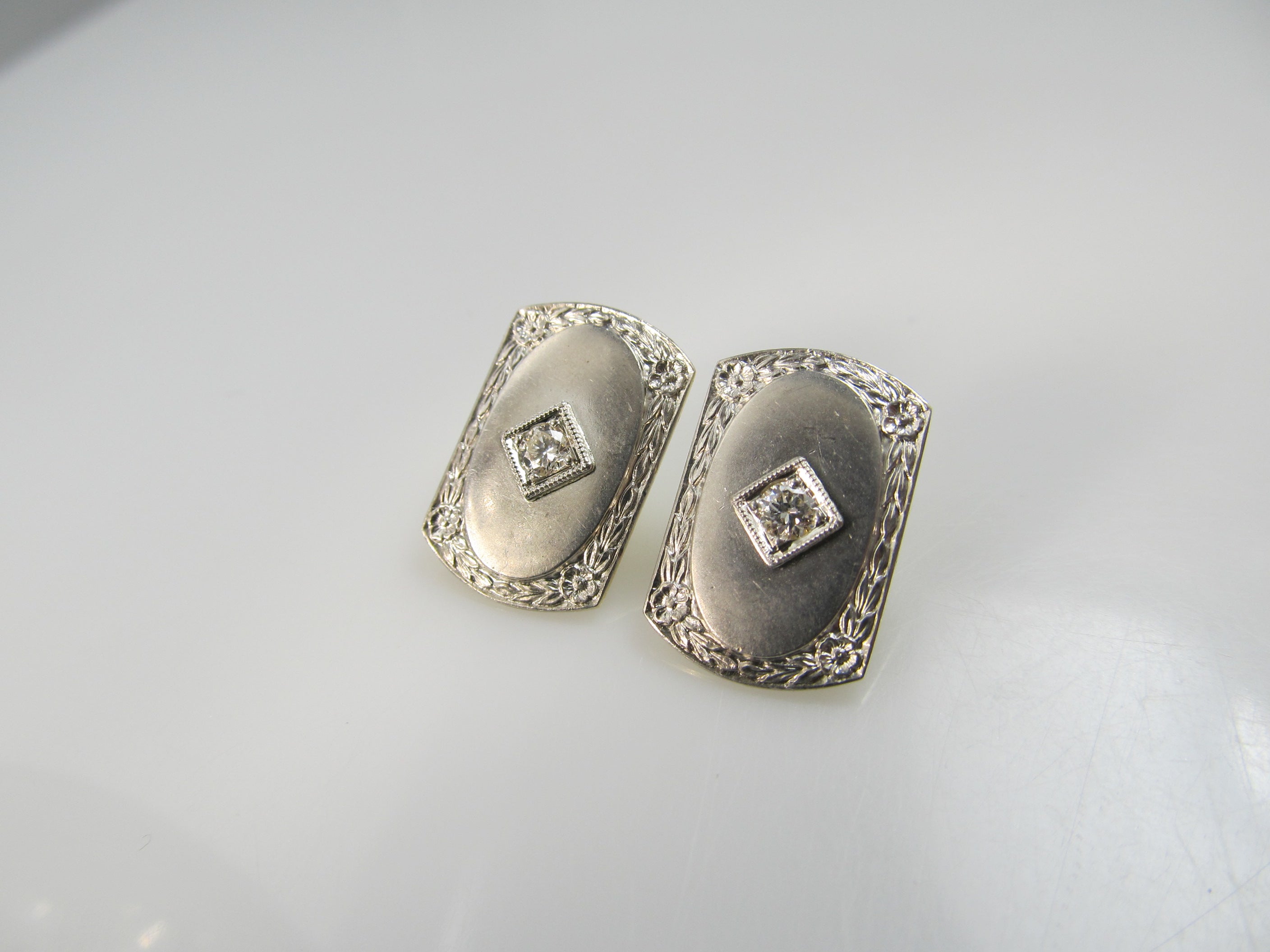 14k and platinum earrings with .20cts in diamonds, circa 1920.