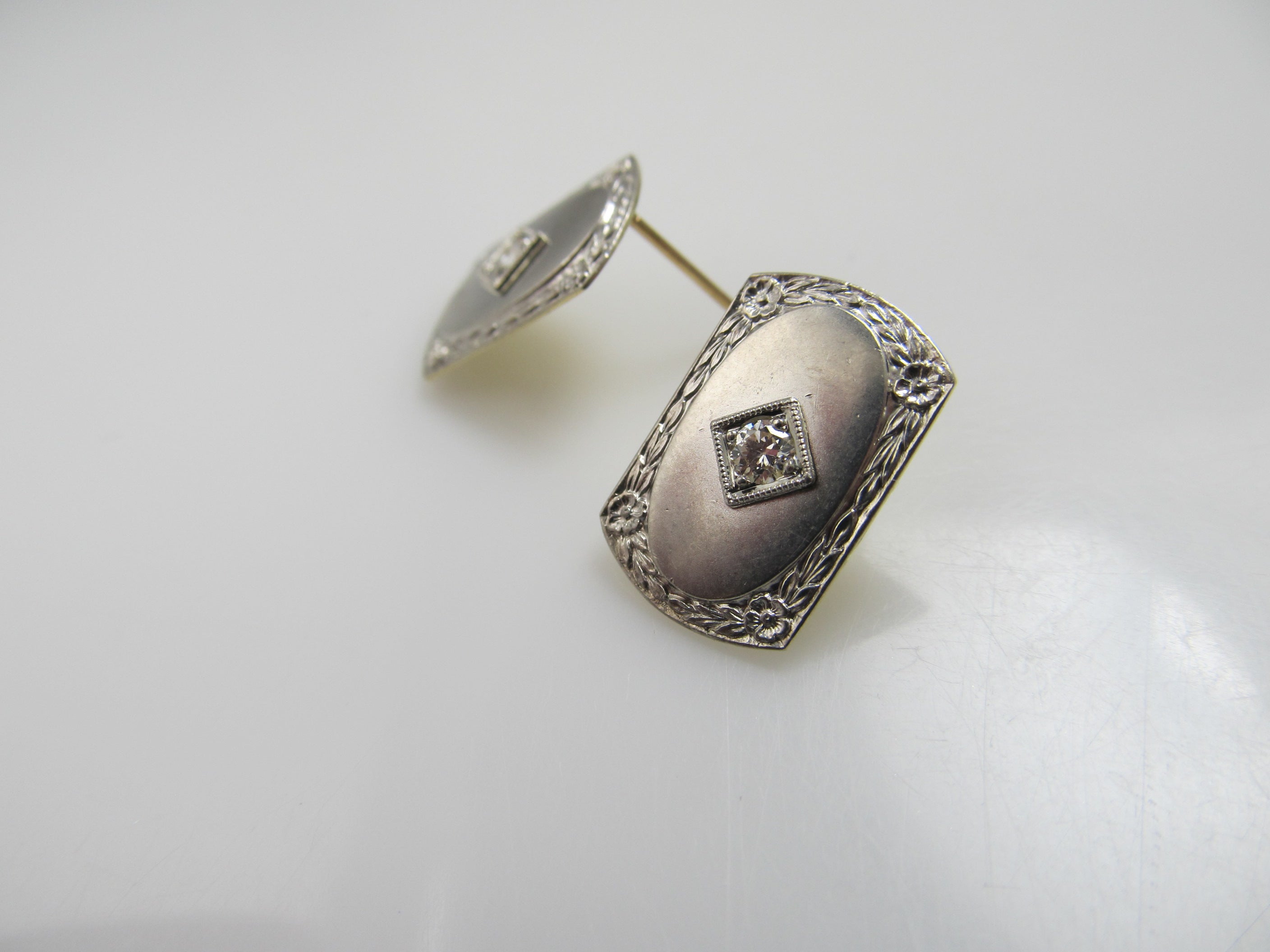 14k and platinum earrings with .20cts in diamonds, circa 1920.