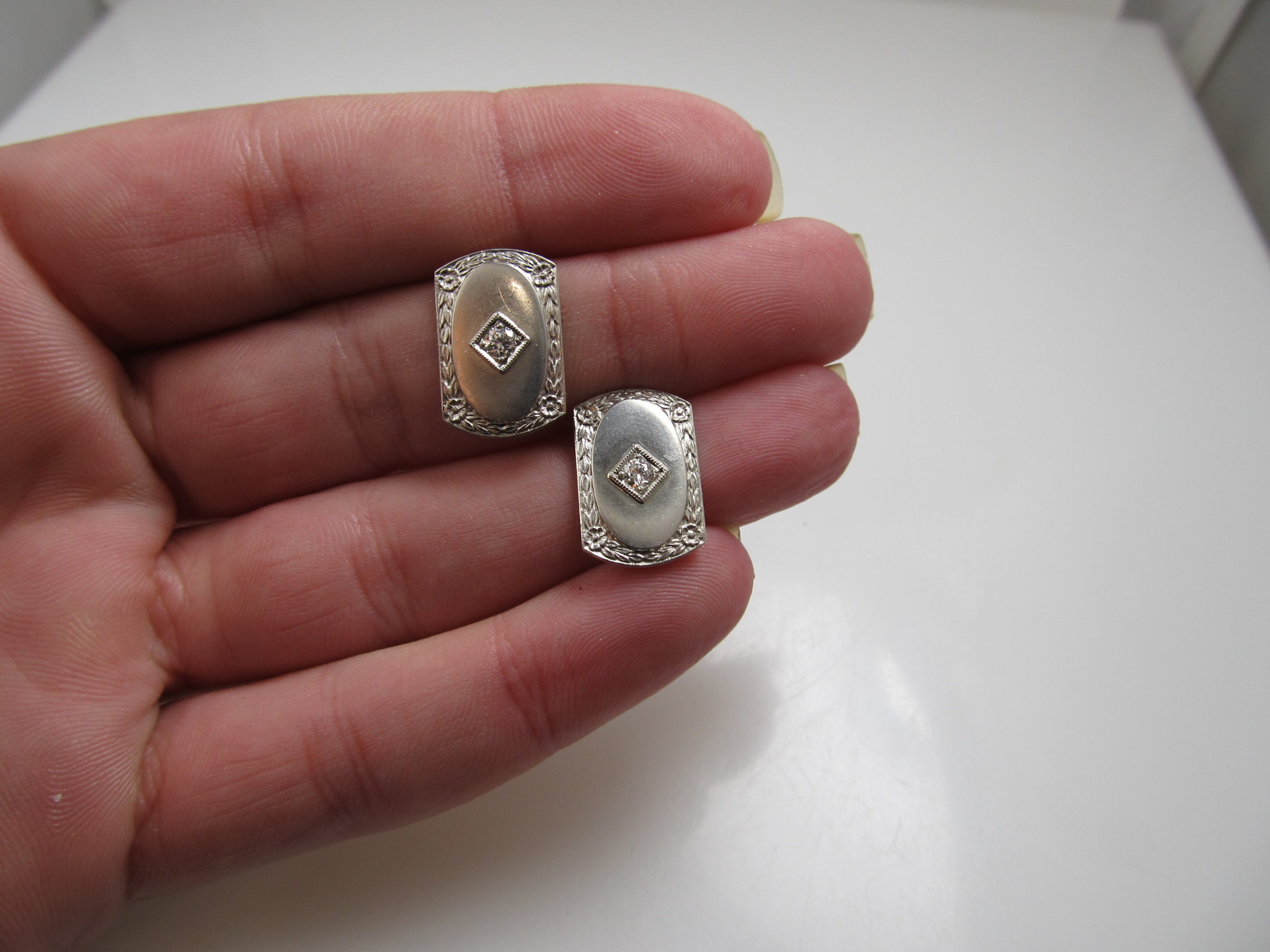 14k and platinum earrings with .20cts in diamonds, circa 1920.