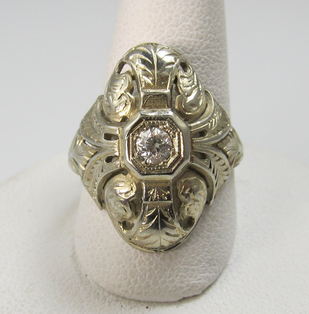 18k white gold filigree ring with a .20ct diamond, circa 1920