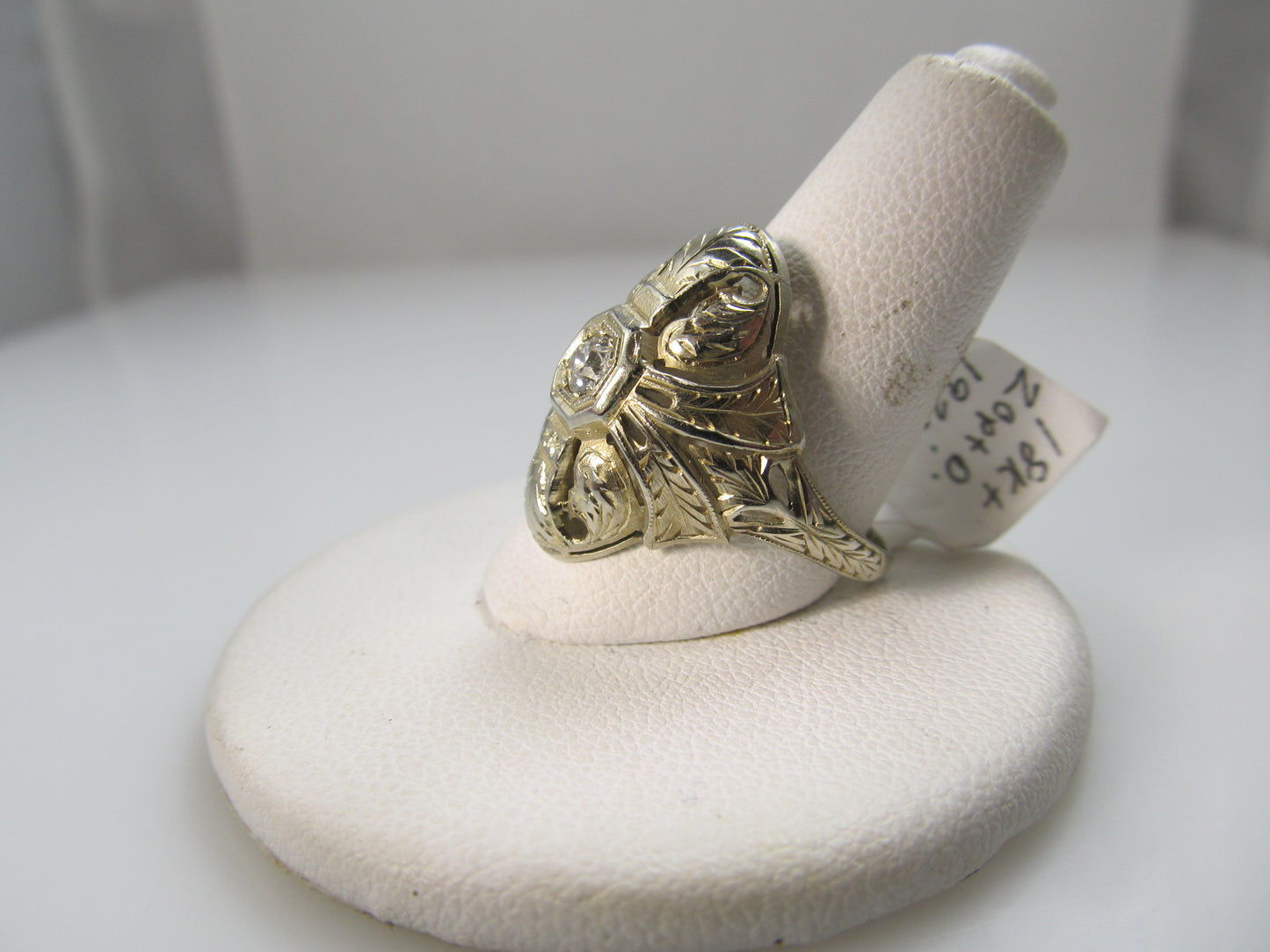 18k white gold filigree ring with a .20ct diamond, circa 1920