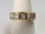 14k yellow gold ring with .70cts in baguette cut diamonds