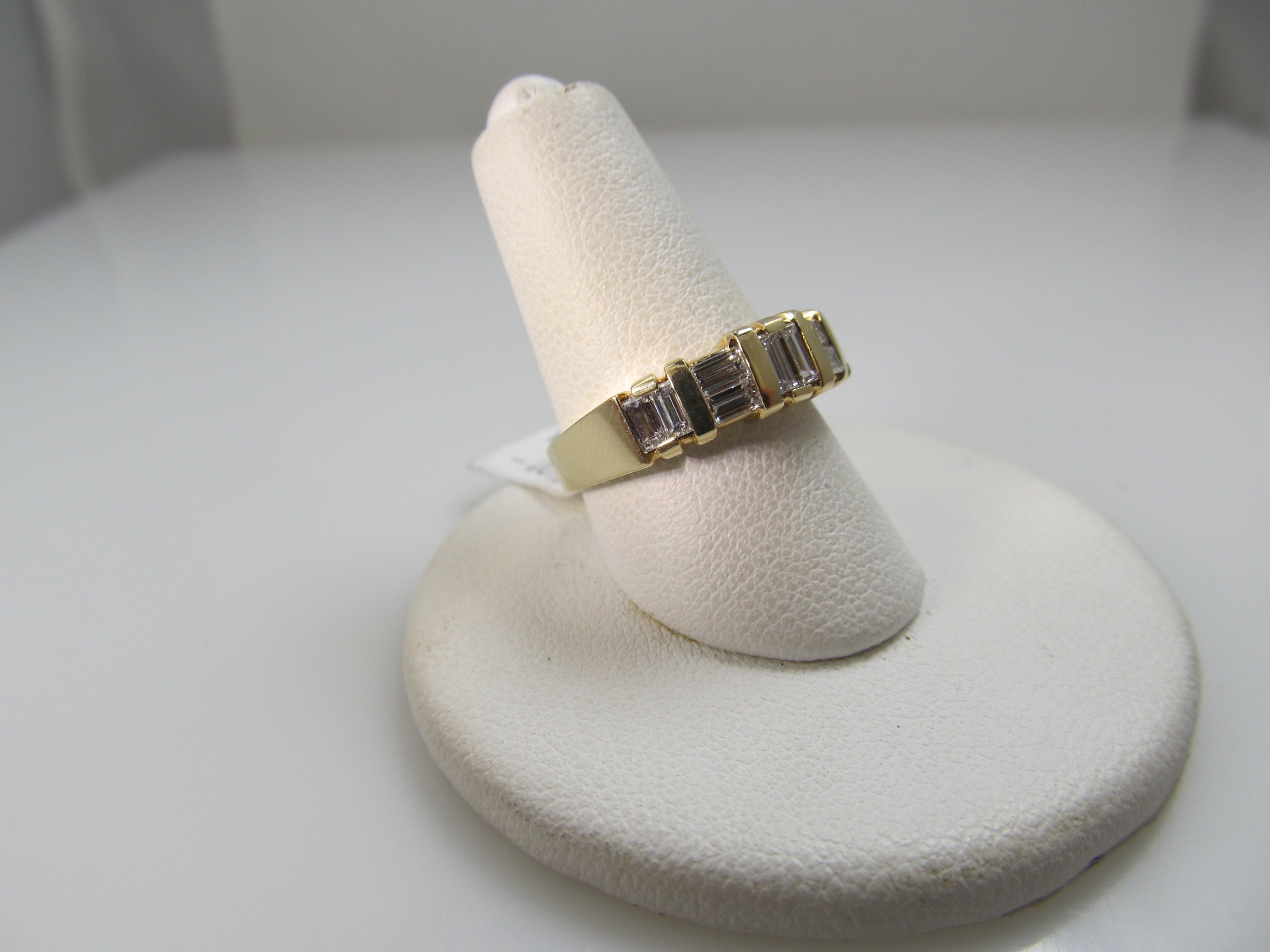 14k yellow gold ring with .70cts in baguette cut diamonds