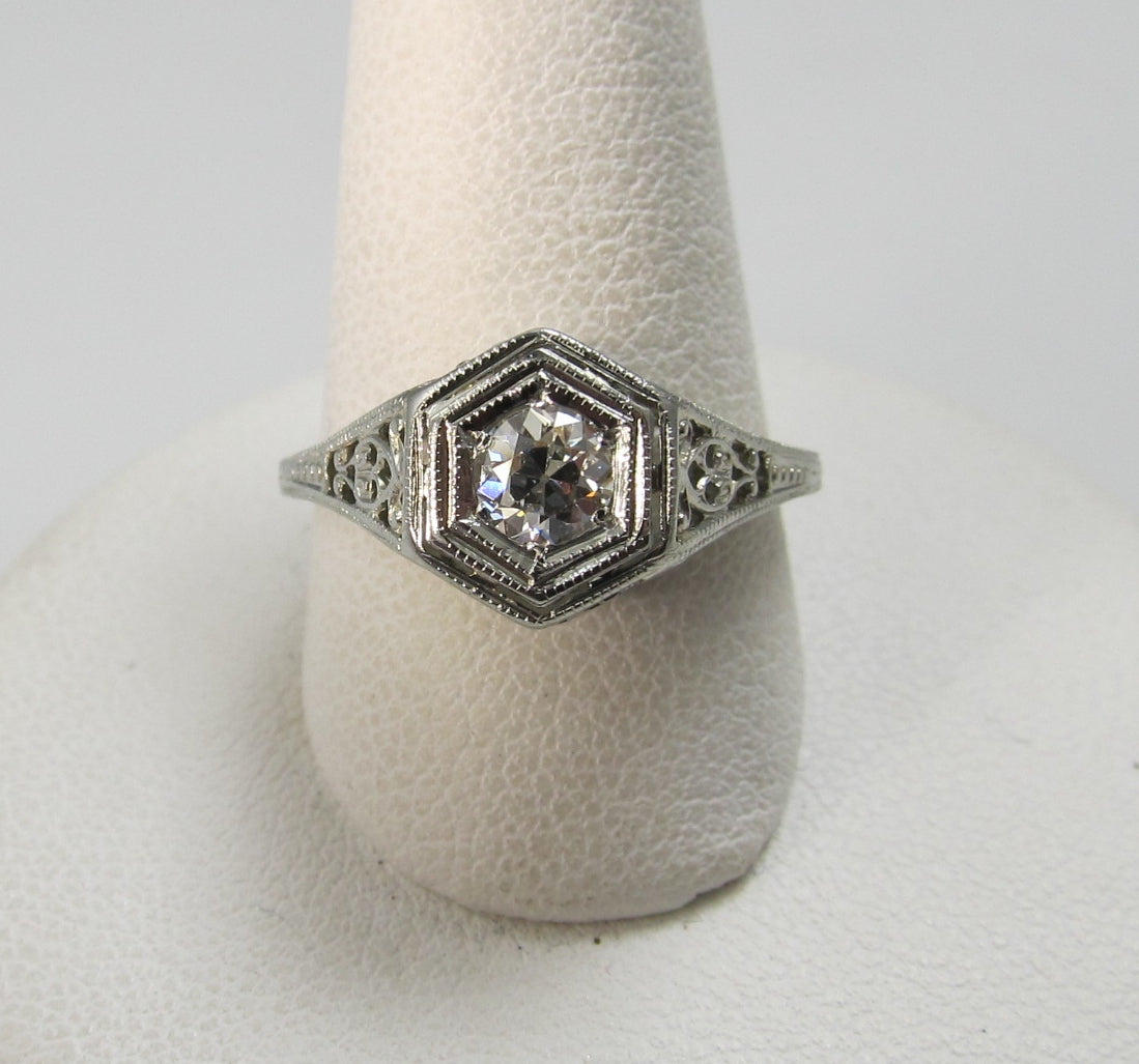 18k white gold filigree ring with a .33ct center diamond, circa 1920