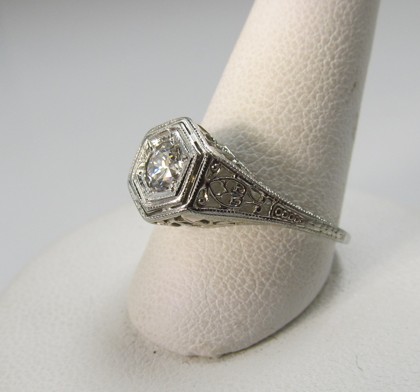 18k white gold filigree ring with a .33ct center diamond, circa 1920