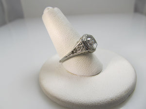 18k white gold filigree ring with a .33ct center diamond, circa 1920